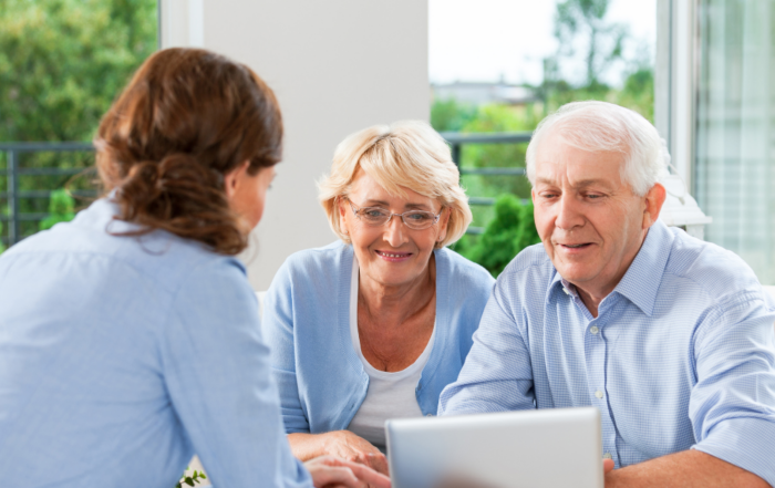 An elderly couple discusses caregiving options with their daughter.