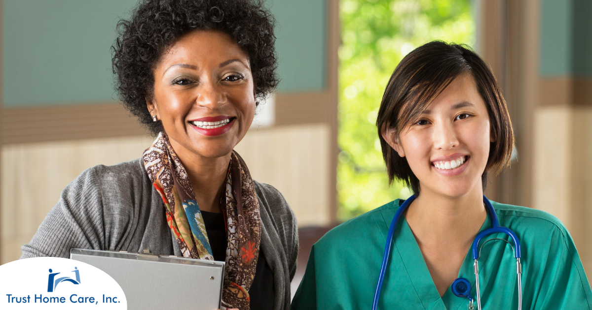 Two different healthcare professionals smile, representing the joy that can come from working with others in the home health environment.