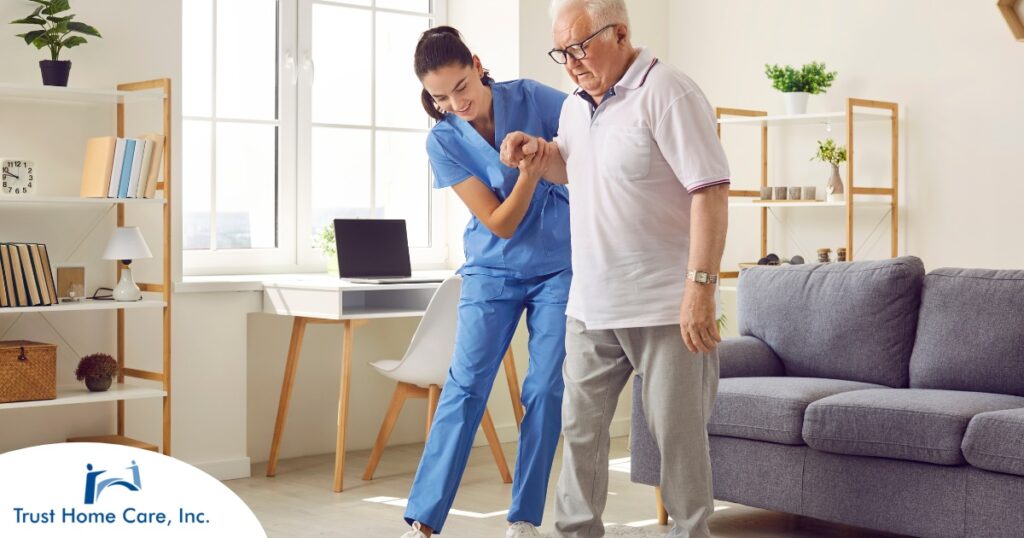 Seniors may need extra help after a fall, and elder care professionals, like this one helping a senior client, can make a massive difference.