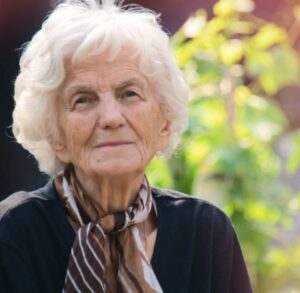 _Alzheimer’s and Dementia Care in Bowie (2) Picture of an elderly woman looking with trees in background. Alzheimer's and Dementia Care in Bowie