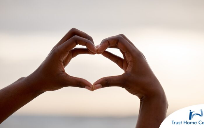 2 hands making a heart represent self-care, a vital concept to appreciate as a caregiver.