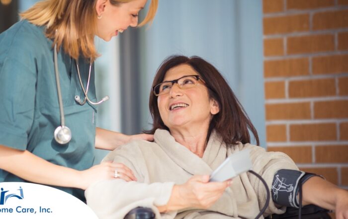 A care provider helps a patient in a wheelchair representing the benefits of medical care at home.