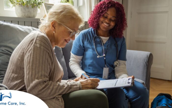 A healthcare professional helps an older patient fill out a form, representing what happens when the requirements for home health care eligibility are met.