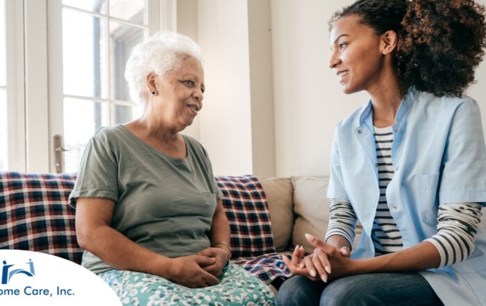 A caregiver sits and spends time with a client, representing how non-medical home care can benefit older loved ones.