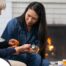 A nurse helps a patient at home with her medications, representing how home health nurses can help with disease management.