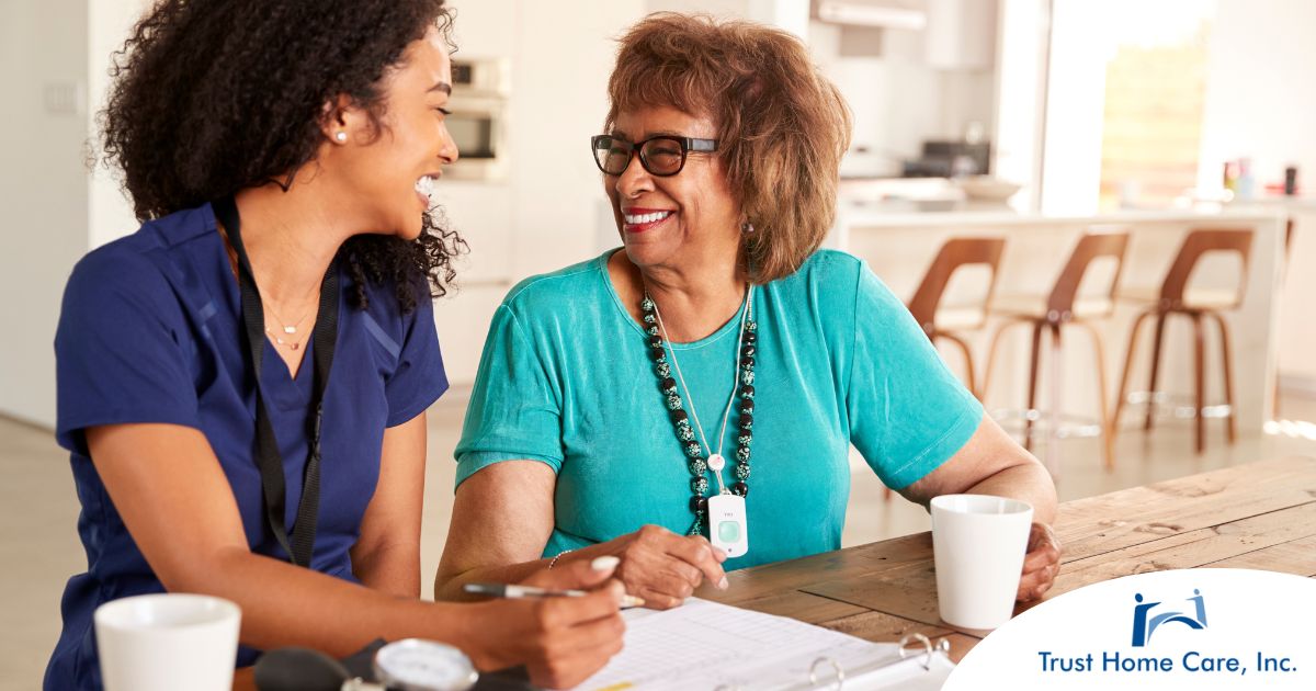 A care provider smiles with an older patient, representing the good results of speech therapy.