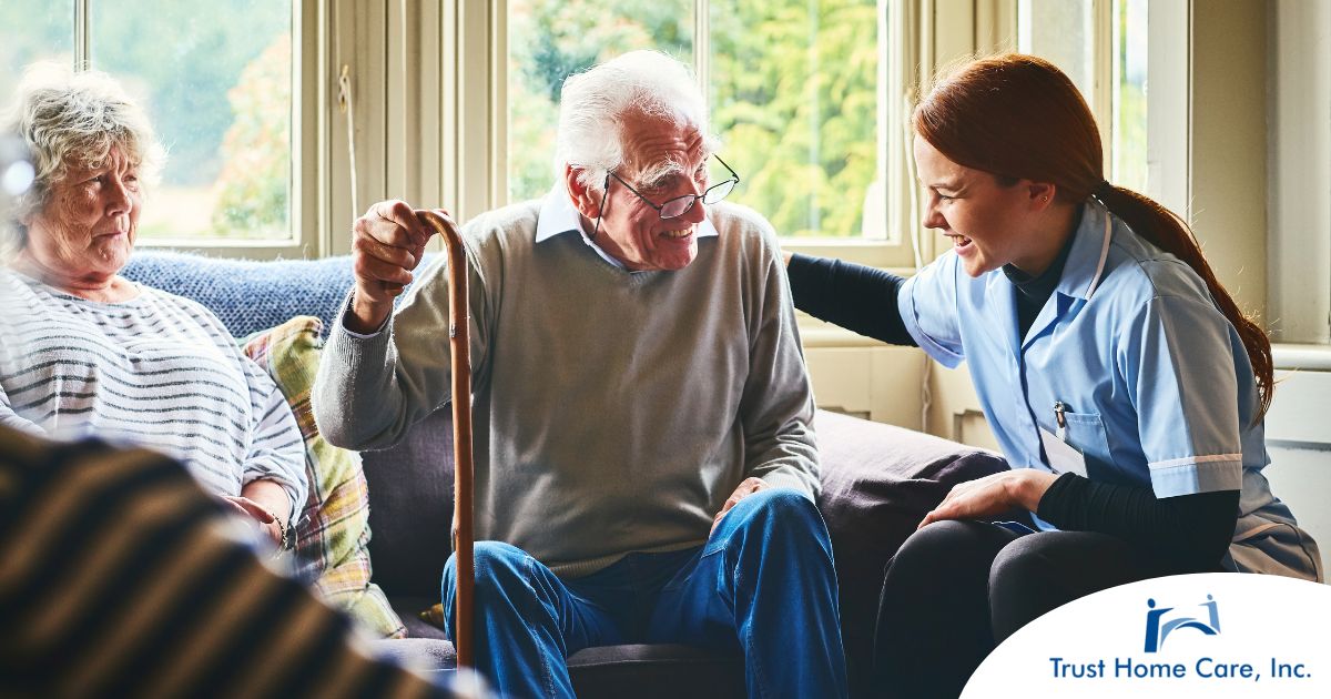 A woman has a good time with her older clients, representing the kind of personal skills needed to be a good caregiver.