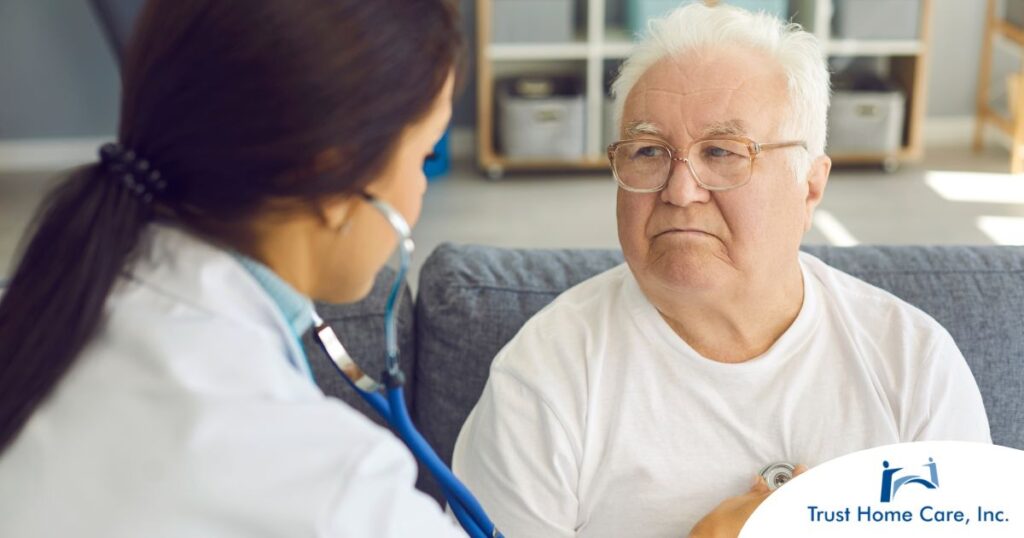 A doctor examines an older man with a stethoscope, representing pneumonia in elderly adults.