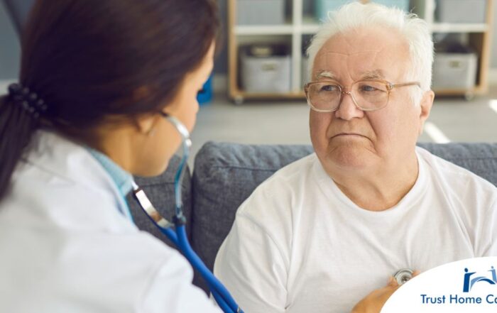 A doctor examines an older man with a stethoscope, representing pneumonia in elderly adults.