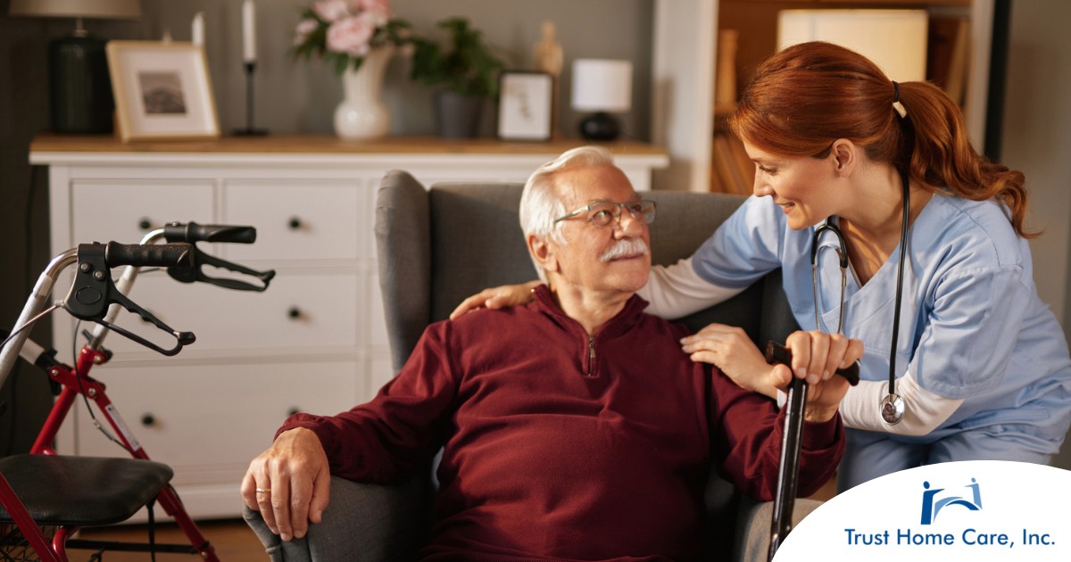 A caregiver helping a woman with a walker make her senior home safer.